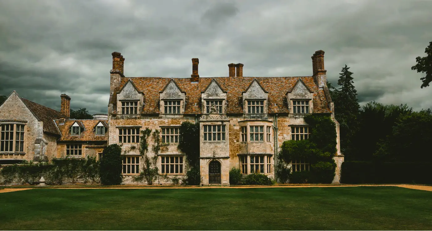 A manor house under changing weather